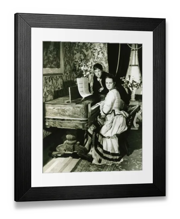 Framed Print : Man and woman posing at spinet, (B&W), portrait