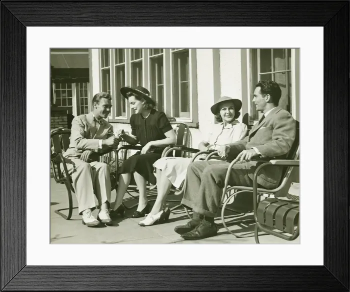 Framed Print : Two couples relaxing outside, (B&W) Framed Print : Two couples relaxing outside, (B&W)