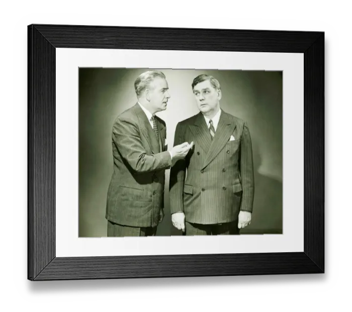 Framed Print : Two businessmen talking in studio, (B&W) Framed Print : Two businessmen talking in studio, (B&W)