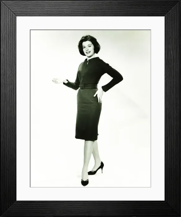 Framed Print : Woman in little black dress posing in studio, (B&W), portrait Framed Print : Woman in little black dress posing in studio, (B&W), portrait