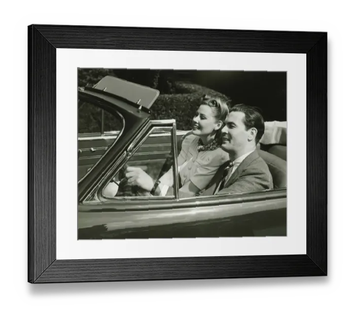 Framed Print : Elegant couple riding in in convertible car, (B&W) Framed Print : Elegant couple riding in in convertible car, (B&W)