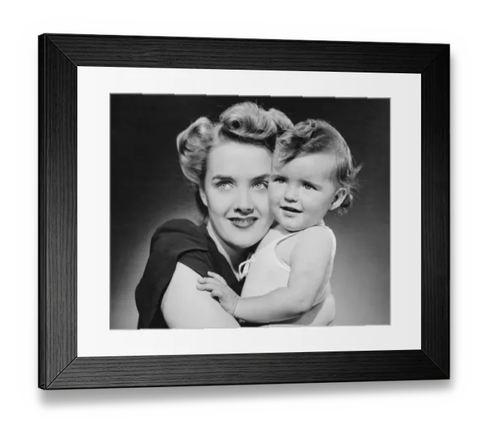Framed Print : Mother hugging baby girl (12-18 months), (B&W), close-up Framed Print : Mother hugging baby girl (12-18 months), (B&W), close-up