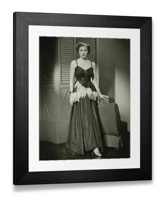 Framed Print : Woman in fashionable evening gown posing at home, (B&W), portrait Framed Print : Woman in fashionable evening gown posing at home, (B&W), portrait