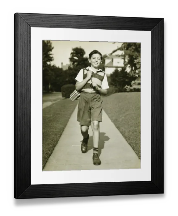 Framed Print : Teenage boy (13-14) going to school, suburbs, (B&W) Framed Print : Teenage boy (13-14) going to school, suburbs, (B&W)