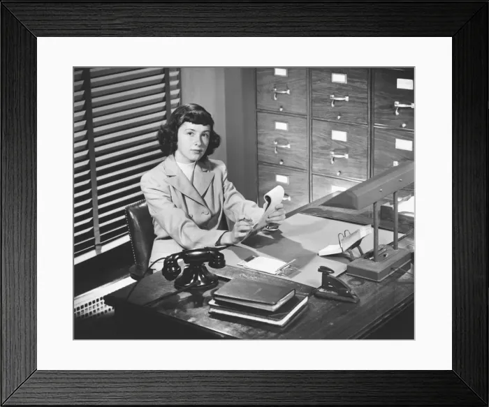Framed Print : Secretary working in office, (B&W) Framed Print : Secretary working in office, (B&W)