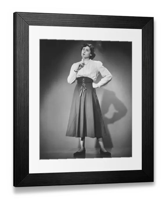 Framed Print : Pensive woman standing in studio, (B&W) Framed Print : Pensive woman standing in studio, (B&W)