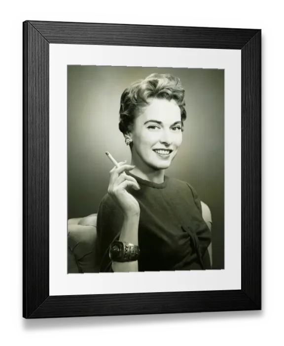 Framed Print : Profile of smiling woman holding cigarette, (B&W), portrait Framed Print : Profile of smiling woman holding cigarette, (B&W), portrait