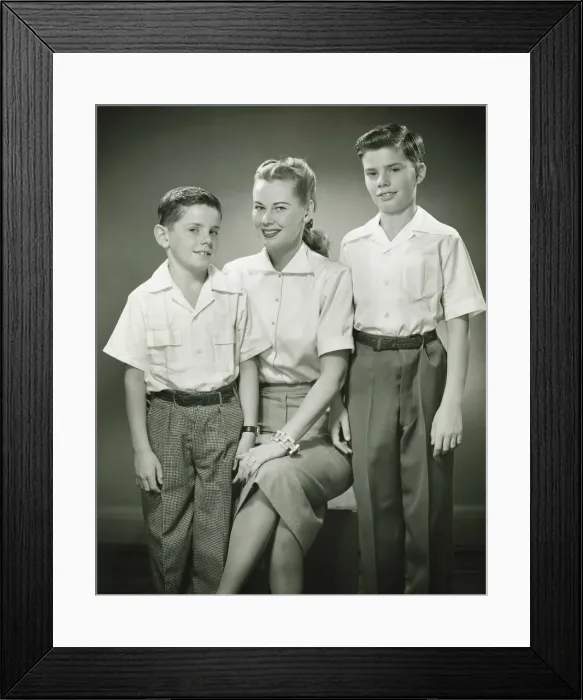 Framed Print : Mother with brothers (8-9) (10-11) sitting in studio, smiling, (B&W), portrait Framed Print : Mother with brothers (8-9) (10-11) sitting in studio, smiling, (B&W), portrait