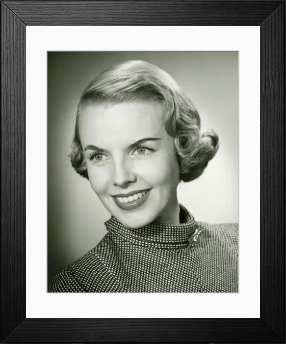 Framed Print : Smiling woman posing in studio, (B&W), portrait, close-up Framed Print : Smiling woman posing in studio, (B&W), portrait, close-up