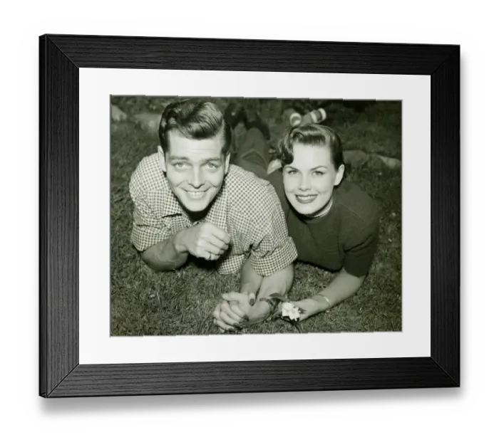 Framed Print : Young couple lying in field, (B&W), portrait Framed Print : Young couple lying in field, (B&W), portrait