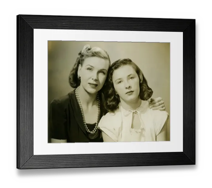 Framed Print : Mother with arm on daughters (10-11) shoulder, (B&W), portrait Framed Print : Mother with arm on daughters (10-11) shoulder, (B&W), portrait