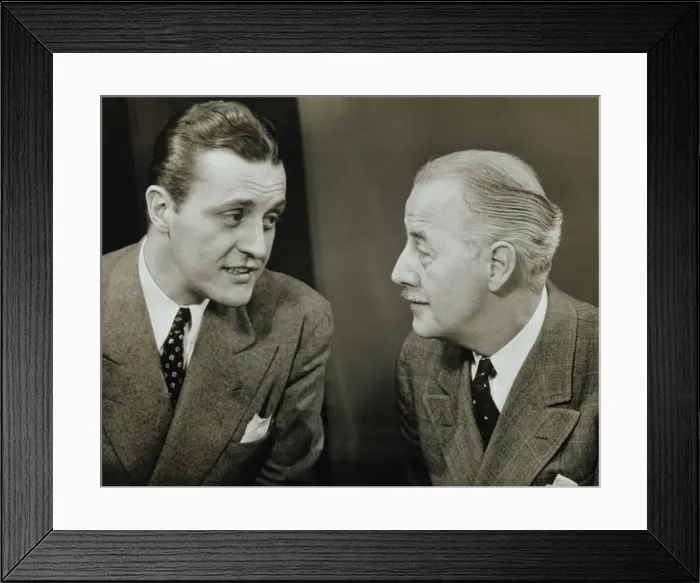 Framed Print : Two elegant men talking in studio, (B&W), close-up Framed Print : Two elegant men talking in studio, (B&W), close-up