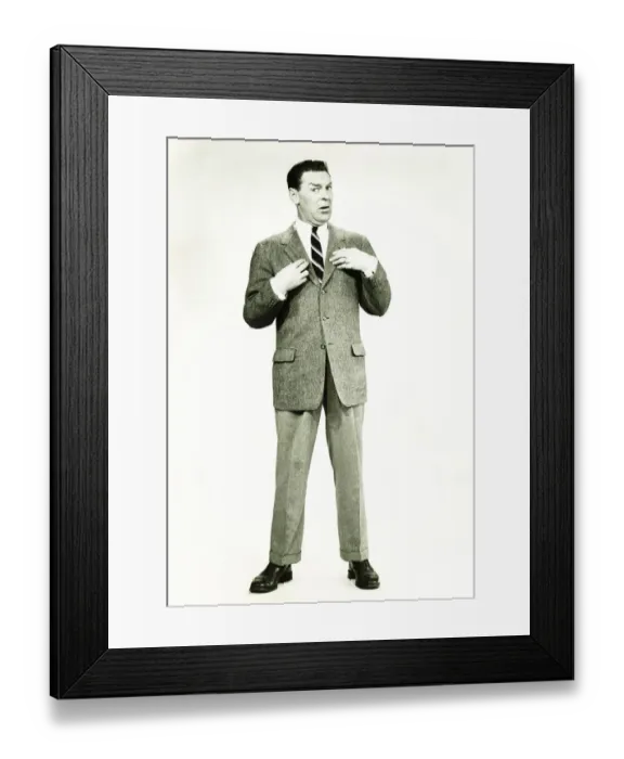 Framed Print : Businessman standing in studio, posing, (B&W) Framed Print : Businessman standing in studio, posing, (B&W)