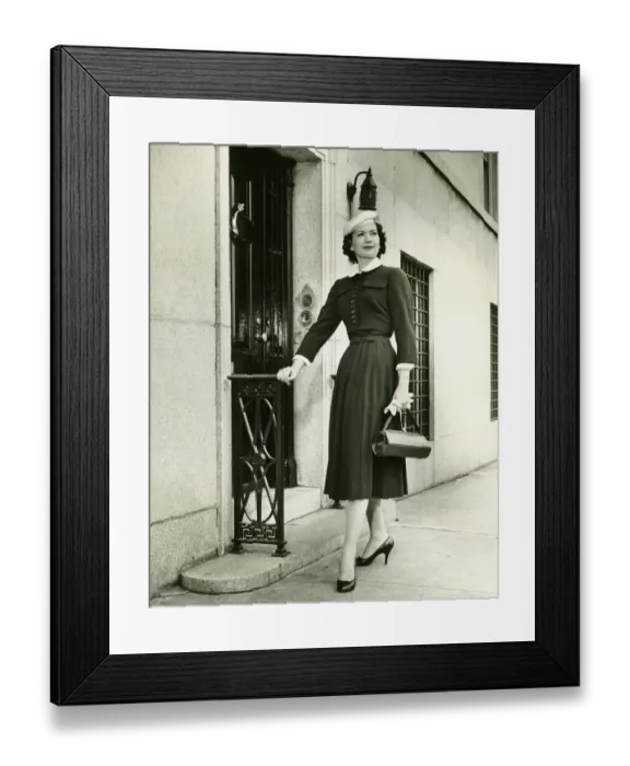Framed Print : Elegant woman posing at building entrance, (B&W), portrait