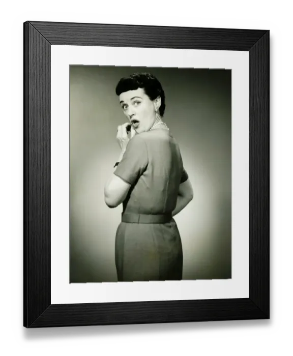 Framed Print : Woman with surprised look in studio, (B&W), portrait Framed Print : Woman with surprised look in studio, (B&W), portrait