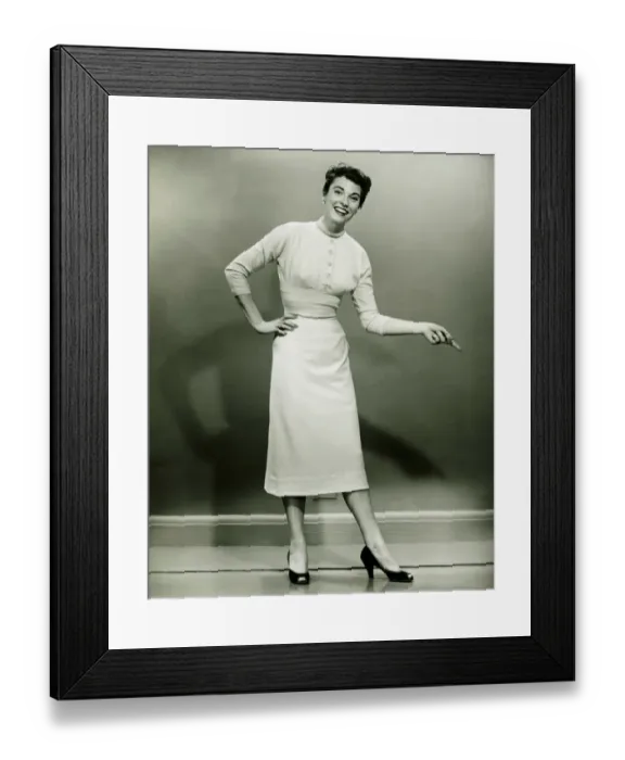 Framed Print : Young woman standing in empty room, gesturing, (B&W) Framed Print : Young woman standing in empty room, gesturing, (B&W)