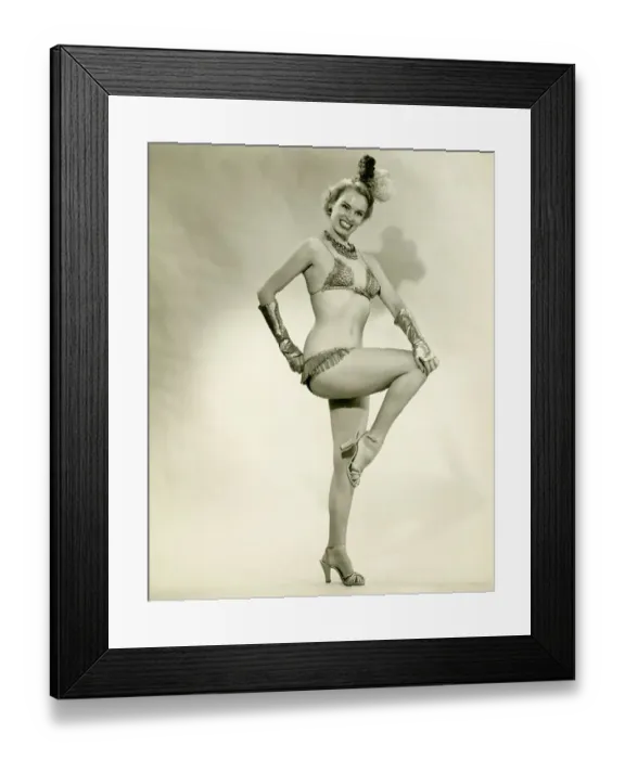 Framed Print : Young woman standing in show girl costume, (B&W) Framed Print : Young woman standing in show girl costume, (B&W)