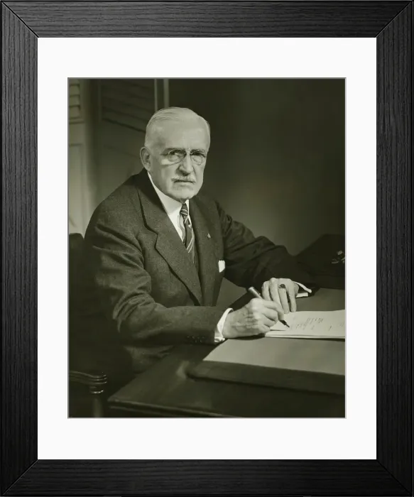 Framed Print : Senior businessman signing documents at desk, (B&W), portrait Framed Print : Senior businessman signing documents at desk, (B&W), portrait