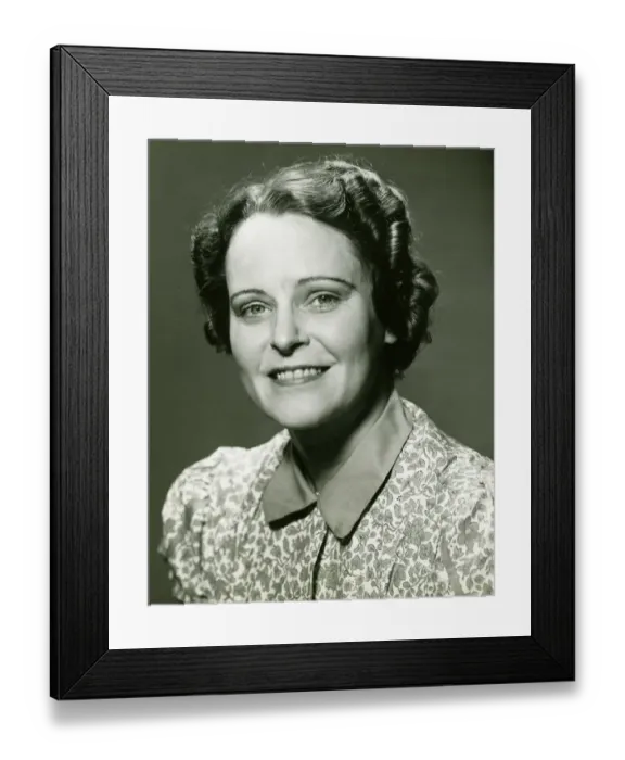 Framed Print : Smiling mature woman posing in studio, (B&W), portrait, close-up Framed Print : Smiling mature woman posing in studio, (B&W), portrait, close-up