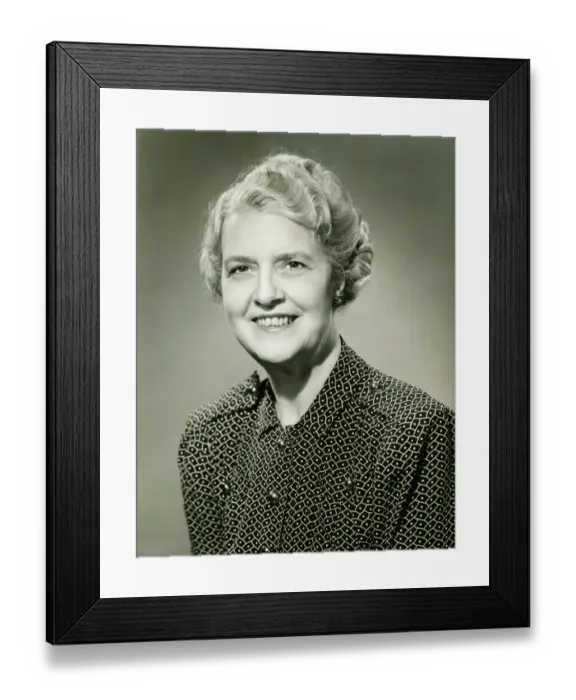 Framed Print : Smiling mature woman posing in studio, (B&W), portrait Framed Print : Smiling mature woman posing in studio, (B&W), portrait
