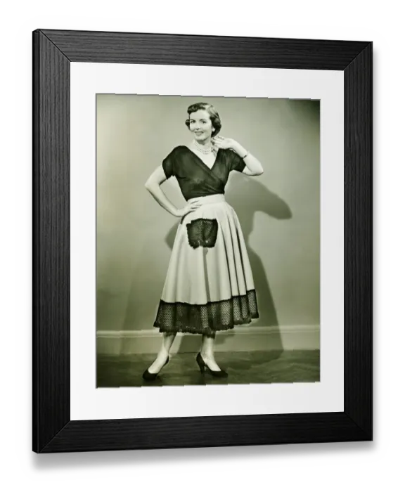 Framed Print : Young woman smiling, posing in empty room, (B&W)