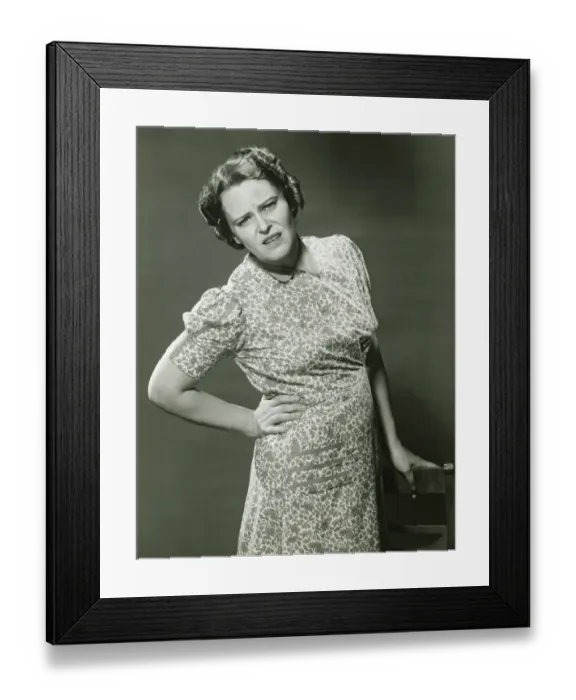 Framed Print : Displeased woman posing in studio, (B&W), portrait Framed Print : Displeased woman posing in studio, (B&W), portrait