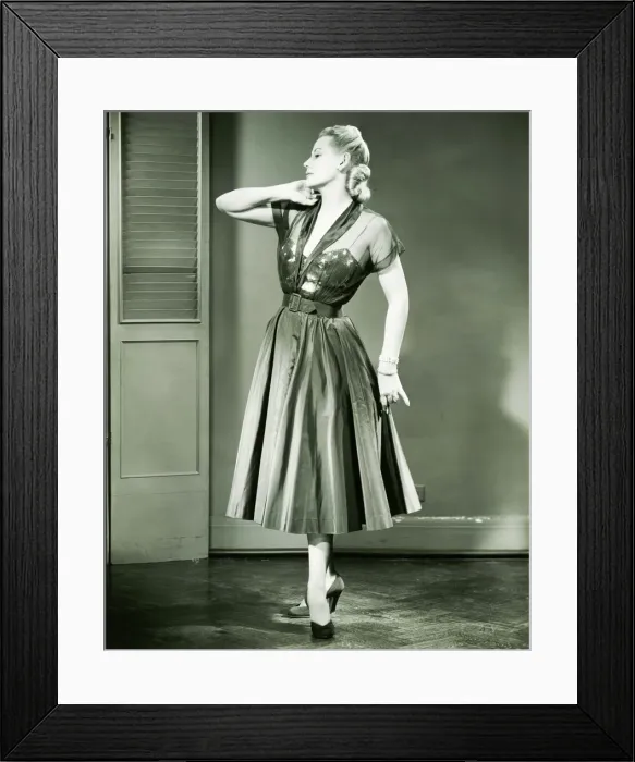 Framed Print : Young woman standing in empty room, (B&W) Framed Print : Young woman standing in empty room, (B&W)