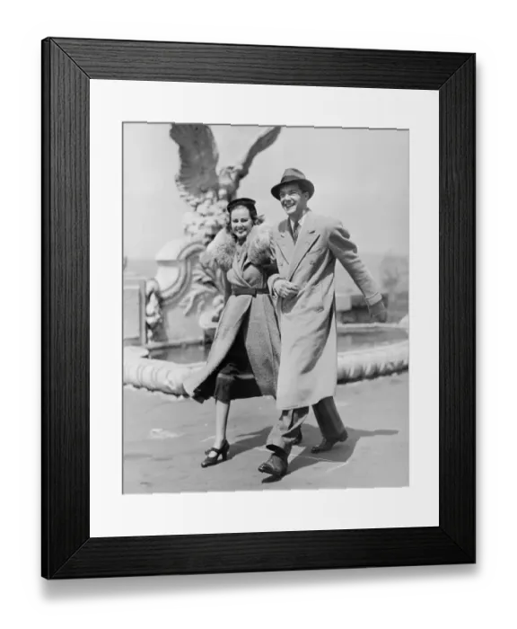 Framed Print : Elegant couple walking on promenade, (B&W) Framed Print : Elegant couple walking on promenade, (B&W)