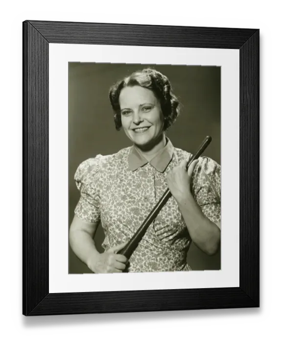 Framed Print : Woman holding stick, posing in studio, (B&W), portrait Framed Print : Woman holding stick, posing in studio, (B&W), portrait