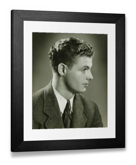Framed Print : Young man posing in studio, (B&W), close-up, portrait Framed Print : Young man posing in studio, (B&W), close-up, portrait