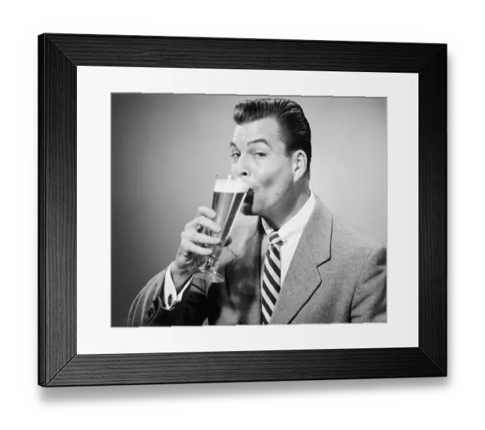 Framed Print : Businessman in full suit drinking beer in studio, (B&W), portrait Framed Print : Businessman in full suit drinking beer in studio, (B&W), portrait