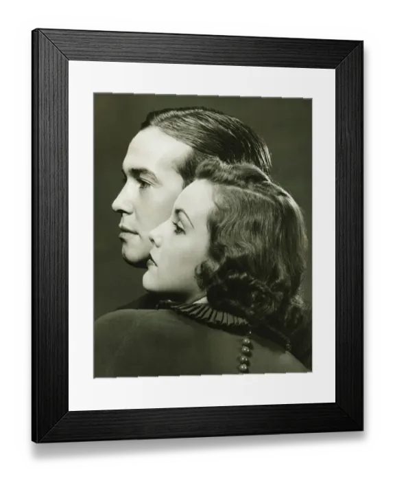 Framed Print : Profiles of couple posing in studio, (B&W), close-up, portrait