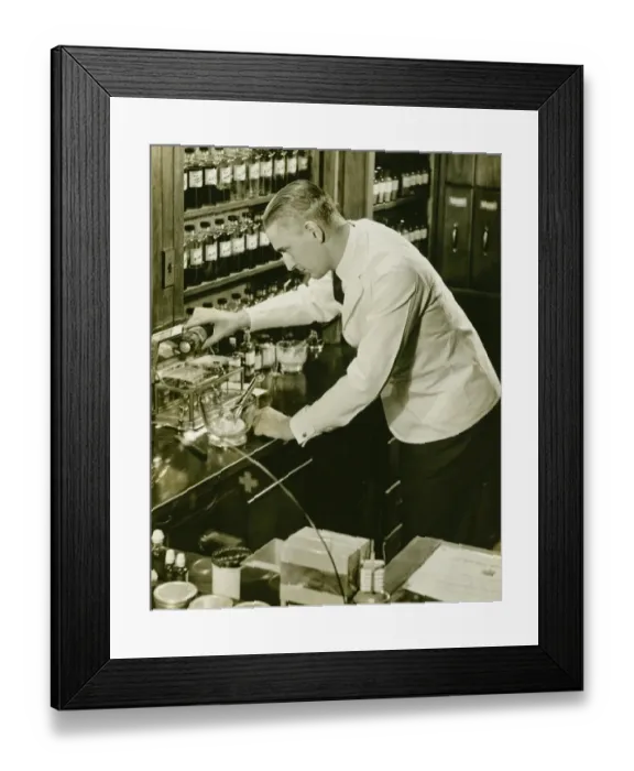 Framed Print : Male pharmacist working in laboratory, (B&W), (Elevated view) Framed Print : Male pharmacist working in laboratory, (B&W), (Elevated view)