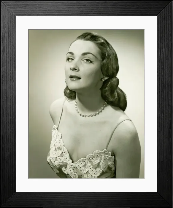 Framed Print : Woman in lace evening gown posing in studio, (B&W), portrait Framed Print : Woman in lace evening gown posing in studio, (B&W), portrait