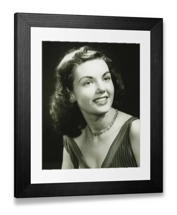 Framed Print : Young woman wearing evening dress, smiling, (B&W), close-up Framed Print : Young woman wearing evening dress, smiling, (B&W), close-up