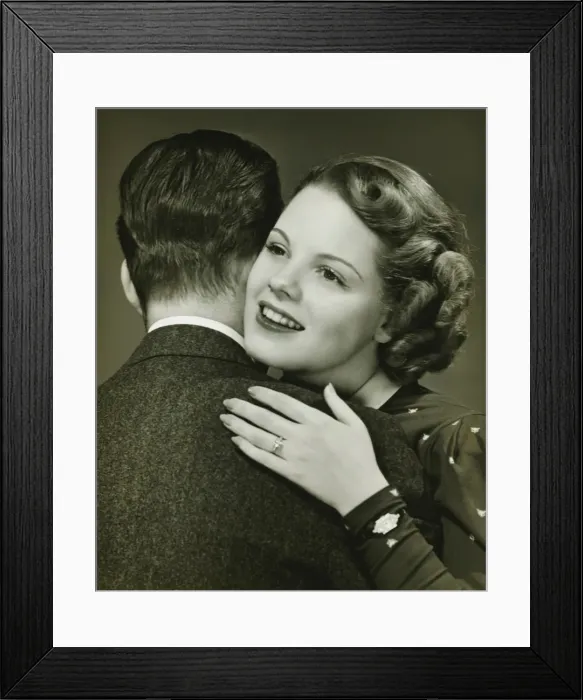 Framed Print : Couple hugging in studio, (B&W), close-up, portrait Framed Print : Couple hugging in studio, (B&W), close-up, portrait