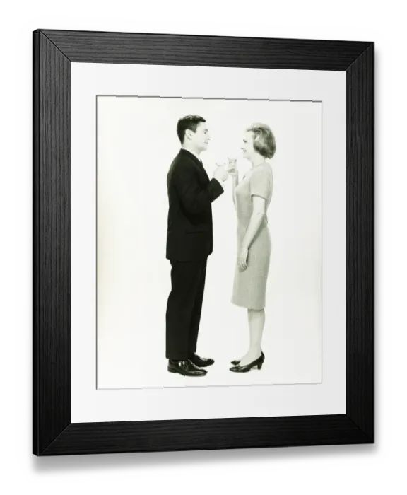 Framed Print : Couple toasting in studio, (B&W)
