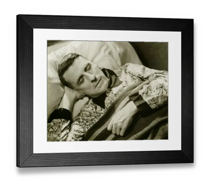 Framed Print : Man wearing silk pyjamas sleeping in bed, (B&W), elevated view Framed Print : Man wearing silk pyjamas sleeping in bed, (B&W), elevated view