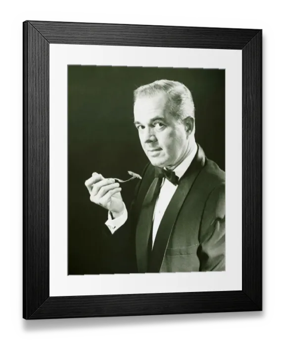 Framed Print : Man holding fork, posing in studio, (B&W), portrait Framed Print : Man holding fork, posing in studio, (B&W), portrait