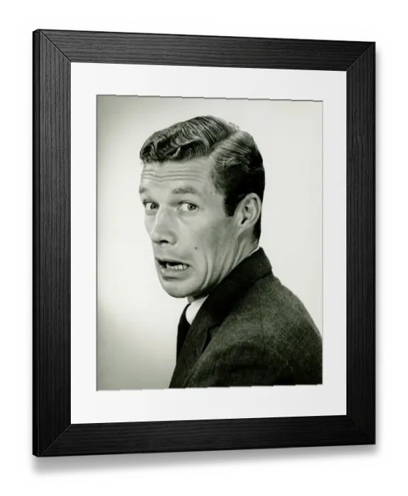 Framed Print : Young businessman looking frightened, posing in studio, (B&W), portrait Framed Print : Young businessman looking frightened, posing in studio, (B&W), portrait