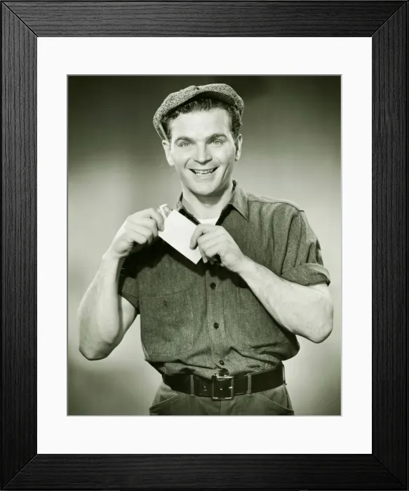 Framed Print : Manual worker holding pay envelope, (B&W), portrait Framed Print : Manual worker holding pay envelope, (B&W), portrait