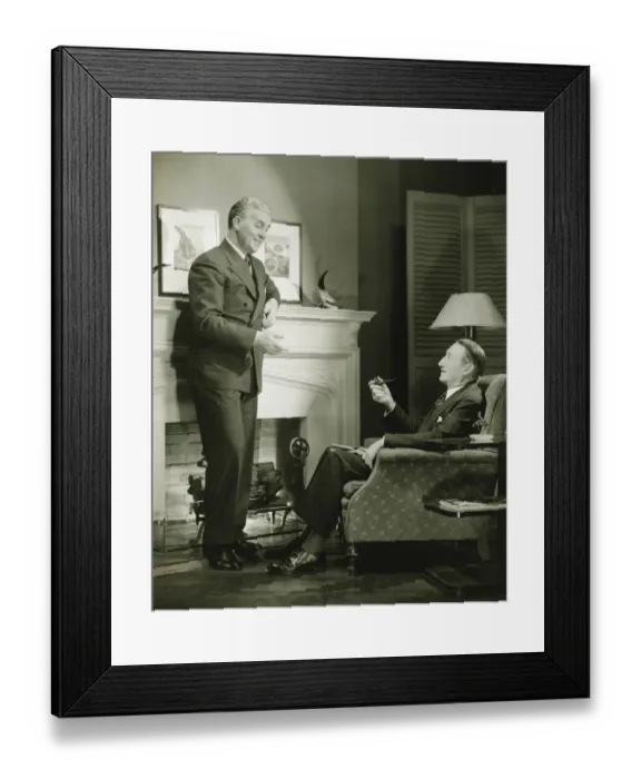 Framed Print : Two elegant men talking by fireplace, (B&W) Framed Print : Two elegant men talking by fireplace, (B&W)