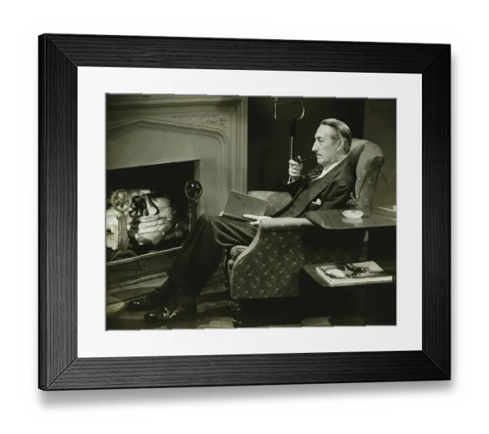 Framed Print : Man sitting on armchair in front of fireplace, (B&W)