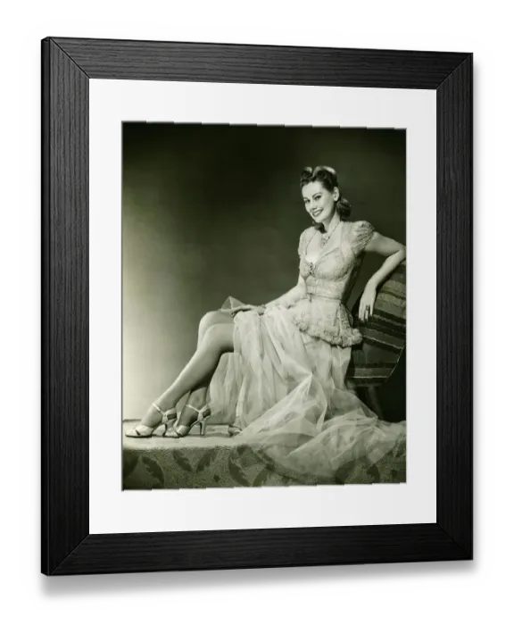 Framed Print : Woman in evening gown posing in studio, (B&W), portrait