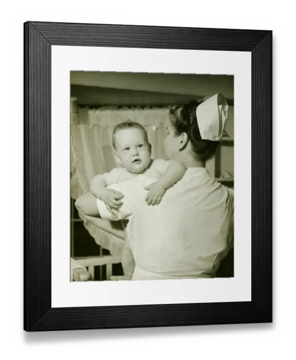 Framed Print : Nurse holding baby boy (6-12 months), (B&W)