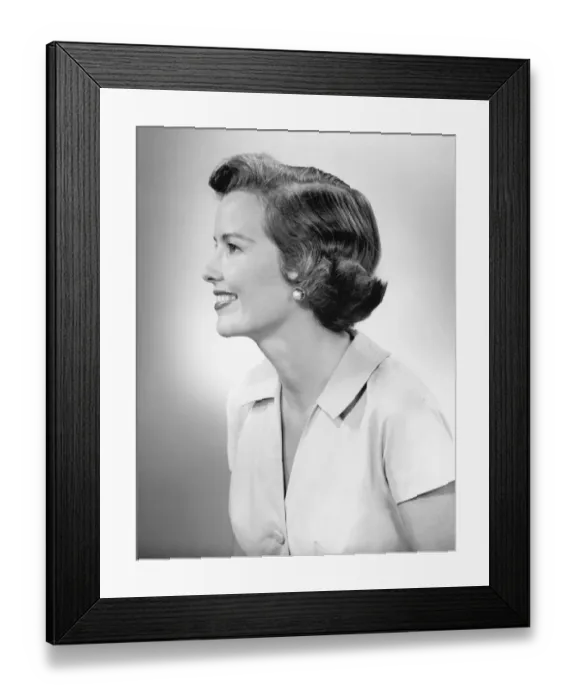 Framed Print : Young woman smiling, posing in studio, (B&W), close-up Framed Print : Young woman smiling, posing in studio, (B&W), close-up