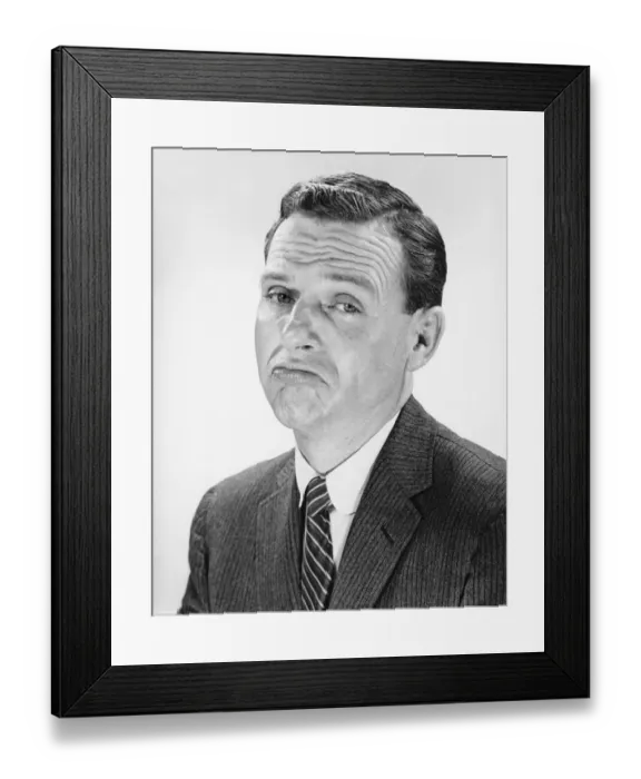 Framed Print : Man shrugging, posing in studio, (B&W), portrait Framed Print : Man shrugging, posing in studio, (B&W), portrait