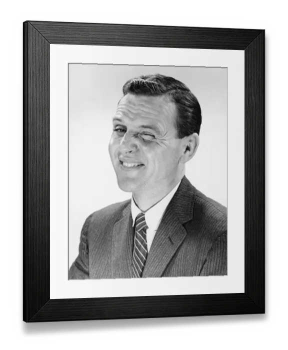Framed Print : Man shrugging, posing in studio, (B&W), portrait Framed Print : Man shrugging, posing in studio, (B&W), portrait