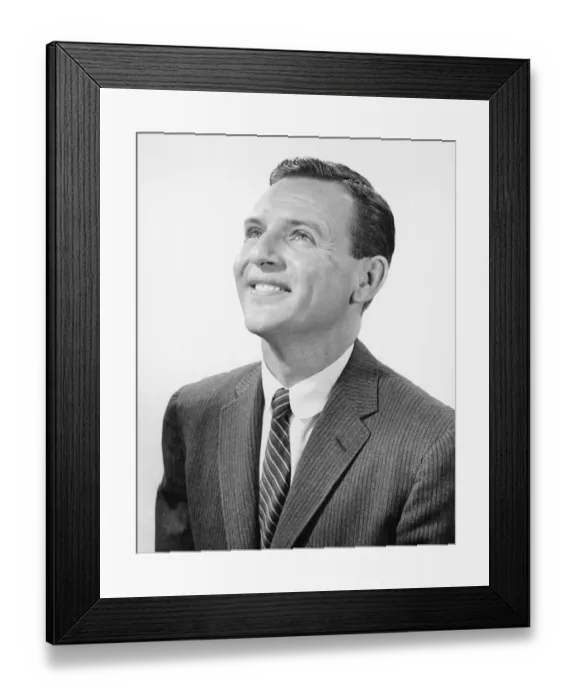 Framed Print : Man posing in studio, looking upwards, (B&W), portrait Framed Print : Man posing in studio, looking upwards, (B&W), portrait