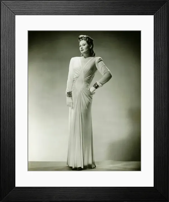 Framed Print : Sophisticated woman in evening gown posing in studio, (B&W), portrait Framed Print : Sophisticated woman in evening gown posing in studio, (B&W), portrait